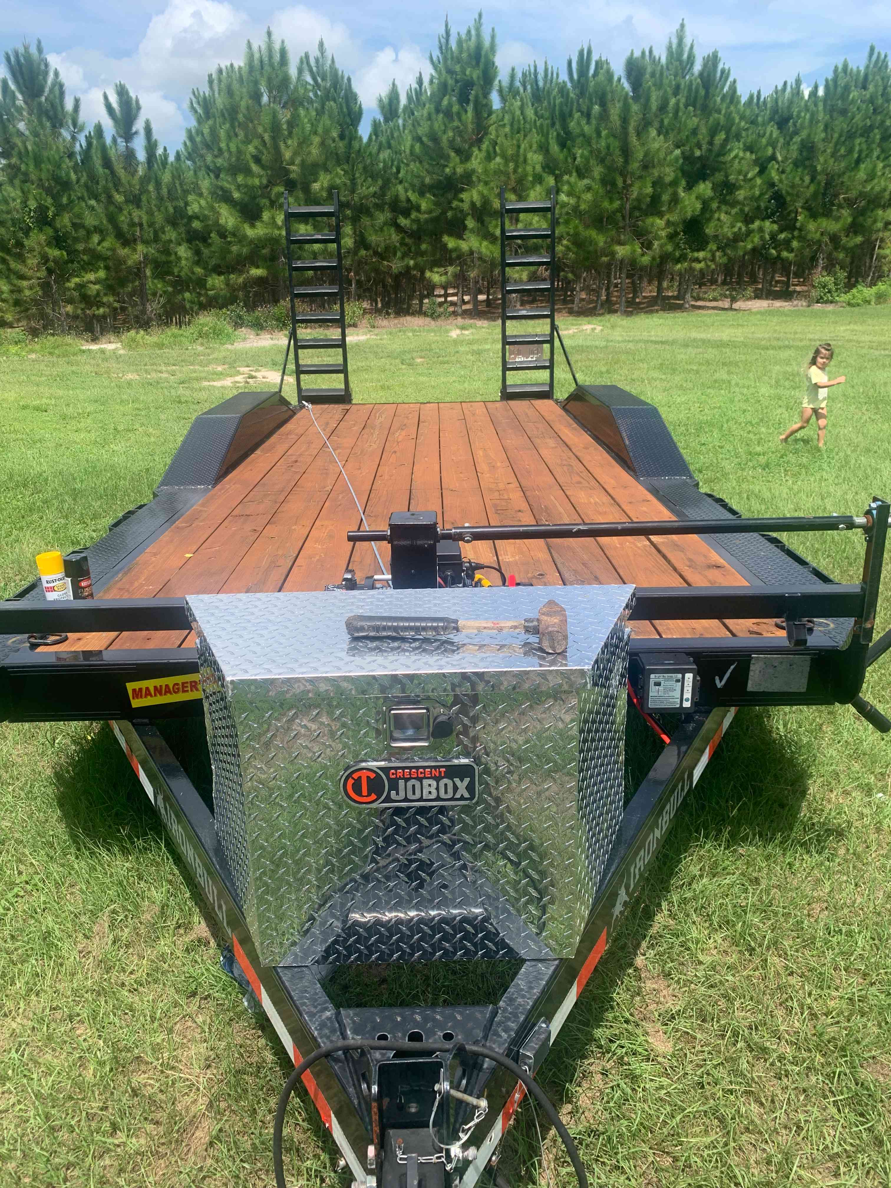 Ironbull 8x20 flatbed car hauler trailer for rent in Fort White FL - 11,200 lb capacity with winch and ratchet straps